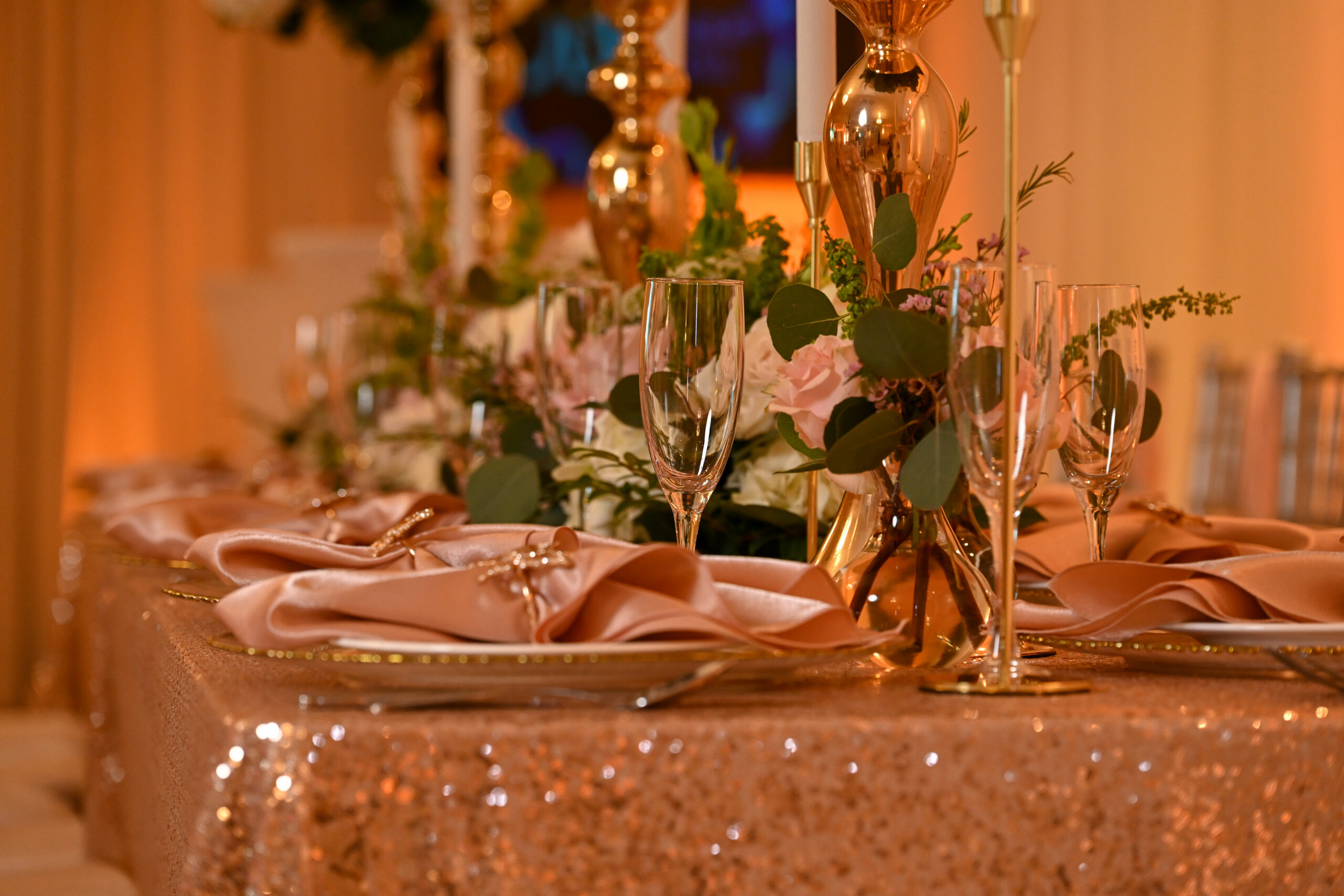 Champagne flutes on a sequin table