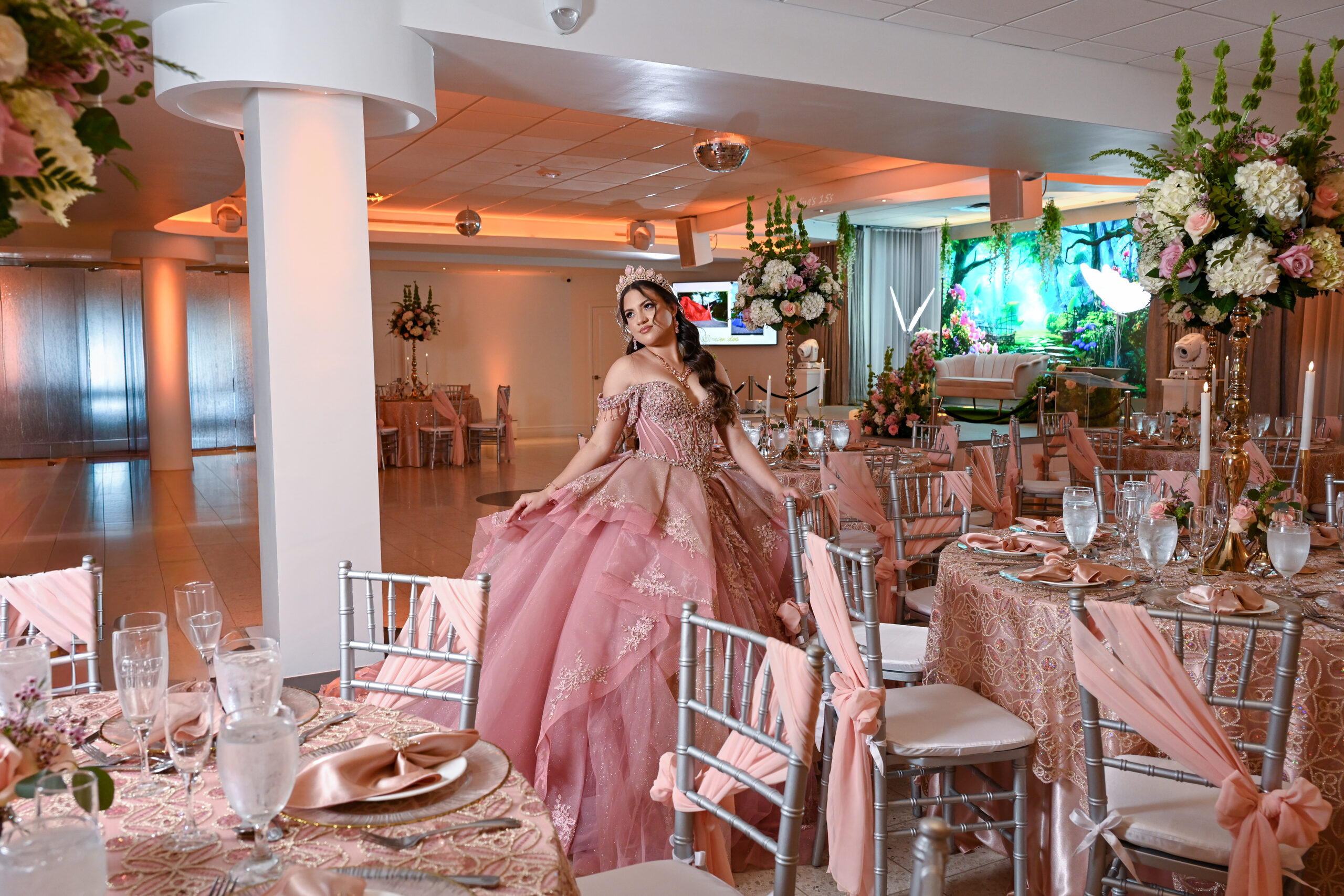 The hall set for a celebration with round tables