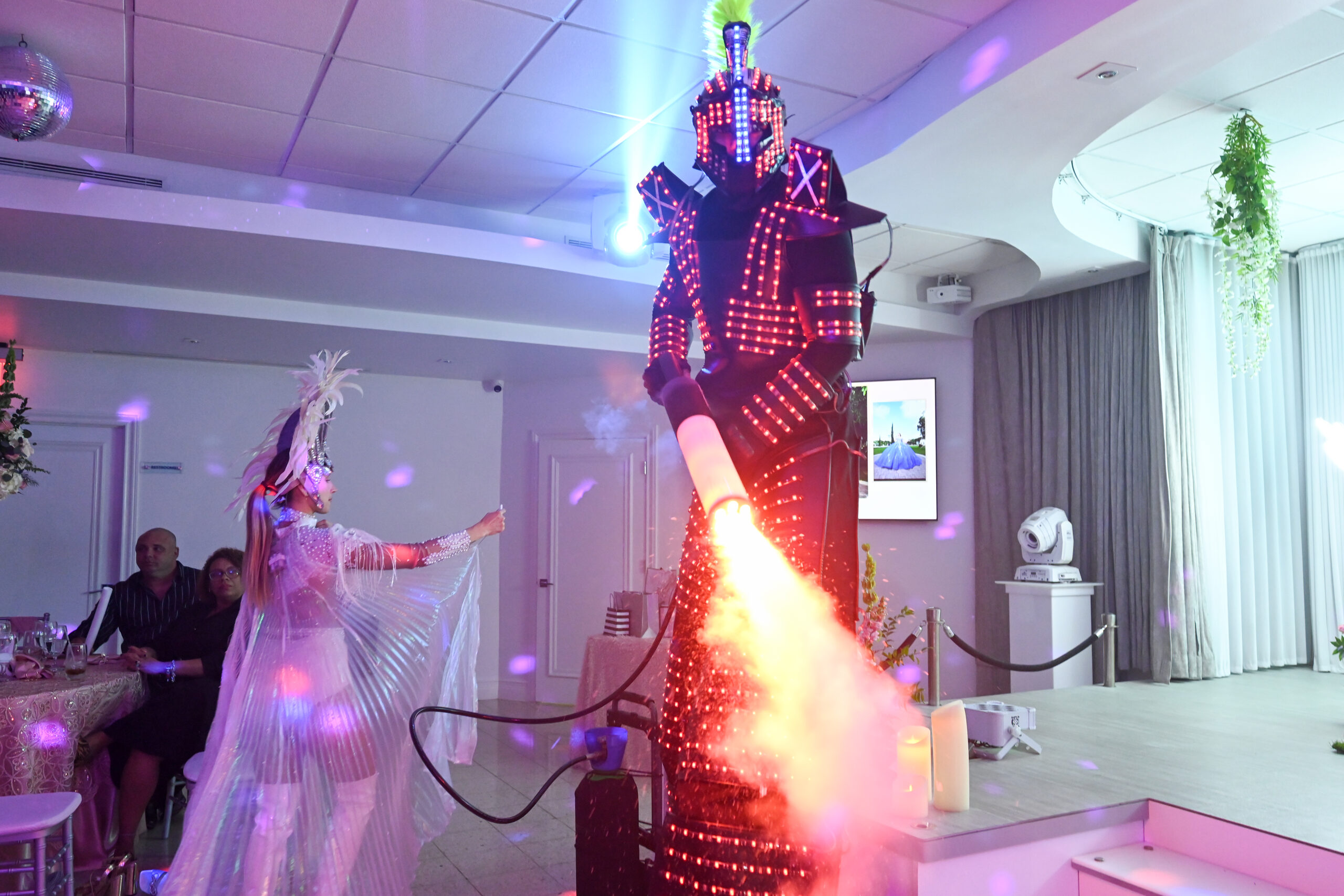 An LED performer on stilts during the hora loca